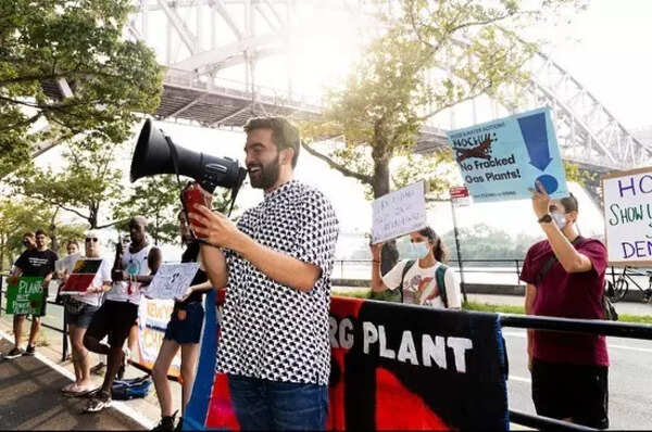 Mamdani advocates in Astoria, demonstrating smart casual layering