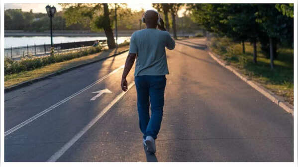 Person walking backwards for cognitive enhancement.