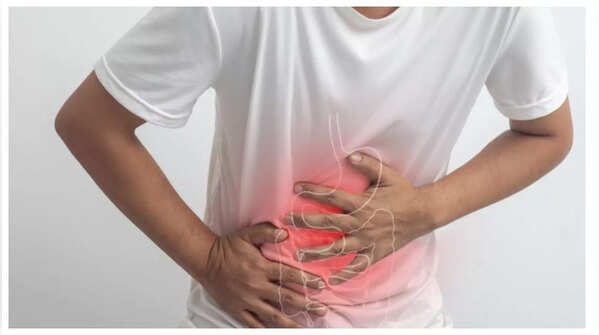 Person holding their stomach in pain.