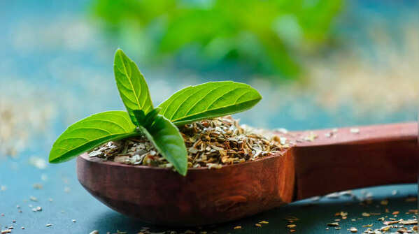 Adding Tulsi Leaves