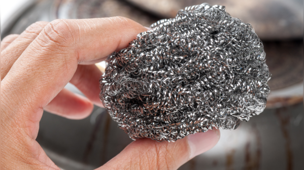 Using steel scrubbers on plastic pans